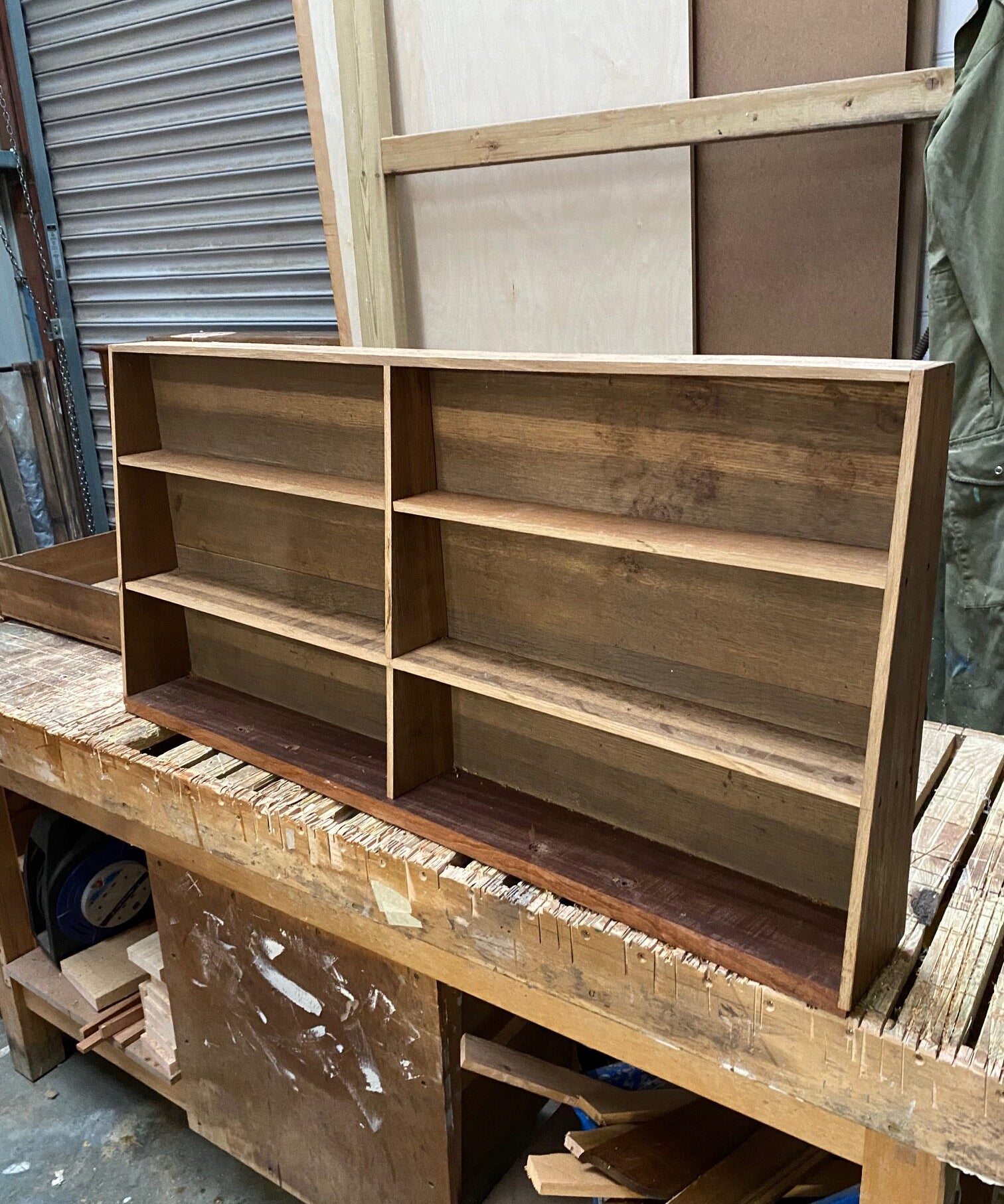 Wooden Shelving Unit with Black Ticking Back