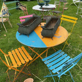 Four Colourful Metal Chairs and Pink Round Maggie