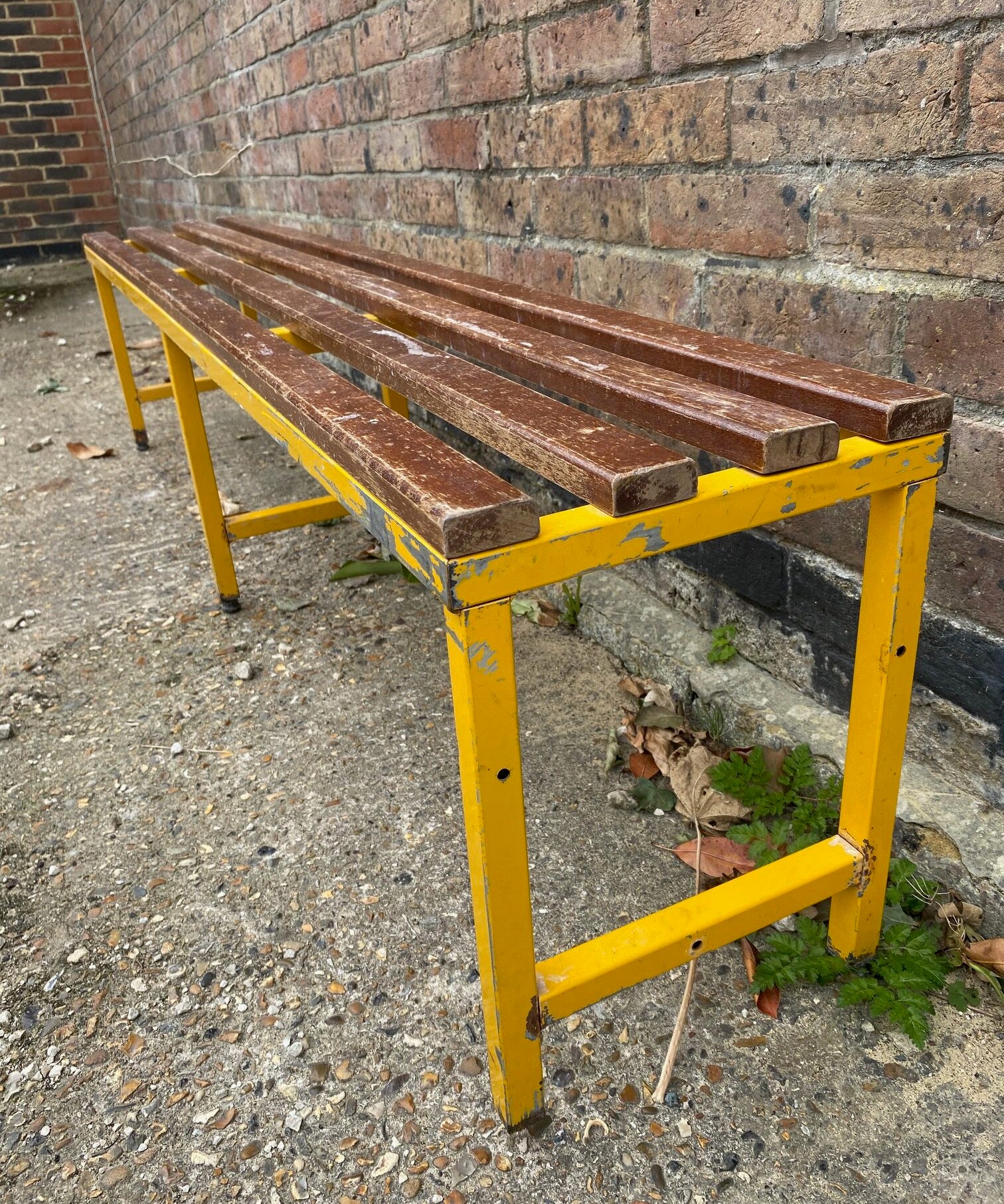 Yellow Metal Bench with Wooden Slatted Top