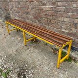 Yellow Metal Bench with Wooden Slatted Top