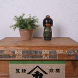 green-creative-kokeshi-doll-1