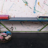 Children's wooden bench with blue top and metal frame
